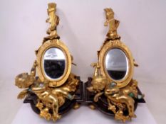 A pair of gilt-metal and marble mirrors in the form of lutes adorned with cherubs and foliage,