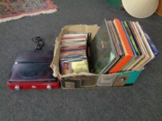 A box of vinyl LP's and seven inch singles including Neil Diamond compilation, Ella Fitzgerald etc,