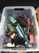 A crate containing a large quantity of plastic die cast and tin plate vehicles by Dinky,