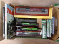 A box containing six Hornby and Atlas model trains mounted on plinths together with books and DVDs