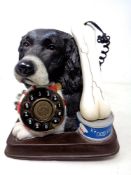 A novelty telephone, dog with bone.