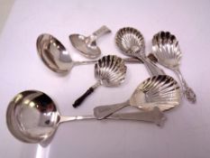 Five assorted caddy spoons including five silver examples.