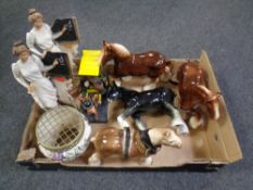 A box containing ornaments to include a Ringtons tea van, four china Shire horses,