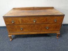 A walnut three over one chest of drawers on Queen Anne legs.