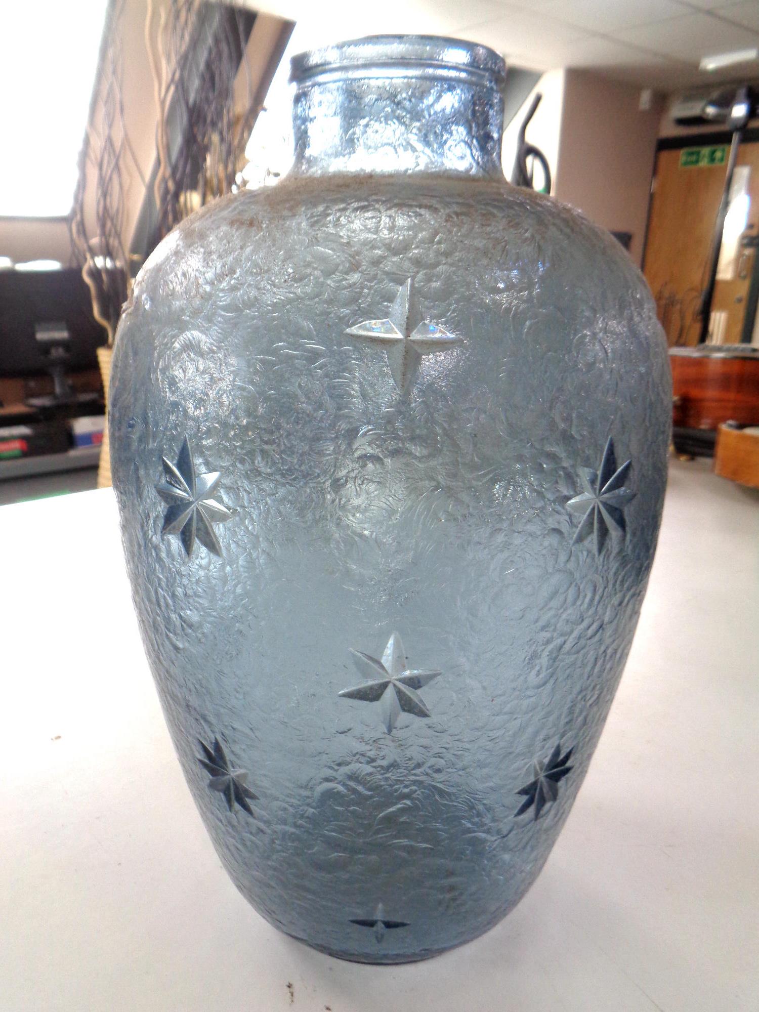 A textured blue glass vase