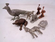 A box containing assorted metal animal figures.