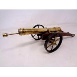 An ornamental table cannon with ramrod.