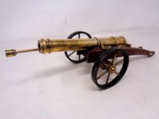 An ornamental table cannon with ramrod.