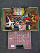 A box and display case containing plastic and die cast vehicles including Matchbox and Lesney