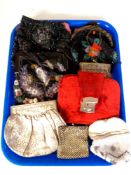 A tray containing a collection of vintage purses including beaded examples.