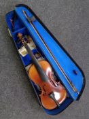 An Antonius Stradivarius copy violin and bow in case