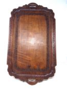 A carved Eastern hardwood twin handled serving tray,