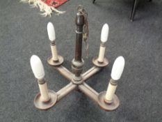A 20th Century beech wood four-way chandelier.