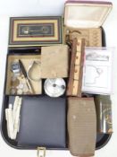 A tray containing wristwatches, coins, dress studs, cased travel game set, cash box,