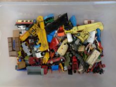 A crate containing a large quantity of mid-20th century and later die cast toys including Corgi,