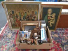 A box containing a frameless mirror, assorted pictures,