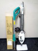 A Shark floor steamer mop together with a Bergman electric weeder and a boxed clothes rail.