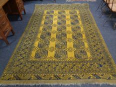 An Afghan Bokhara carpet on gold ground 305cm by 202cm