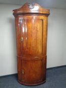 An antique continental double corner cabinet.