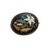 An oval pietra dura brooch in gold frame