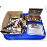 A tray containing a quantity of assorted wristwatches, walking stick badges,