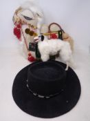 A tray containing a Renegade cowboy hat together with two soft toys, camel and dog.