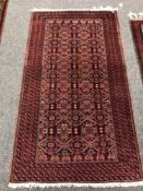An Afghan rug of geometric design 95 cm x 168 cm