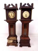 Two pocket watch stands in the form of grandfather clocks together with two pocket watches by