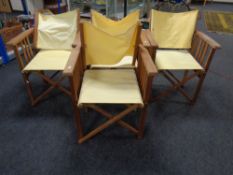 Four folding directors chairs.