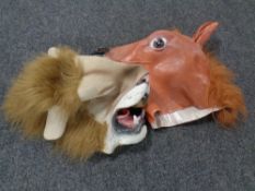 Two rubber face masks, lion and horse.