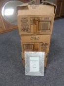 Three boxes containing a total of 63 Xenos Fotolijist silver finish wooden photo frames (10cm by