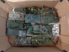 A crate containing Corgi and Dinky die cast military vehicles including tanks.