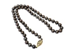 A strap of pearls on 18ct gold clasp
