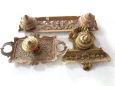 Three ornate brass inkwells