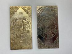 Two Chinese white metal ingots.