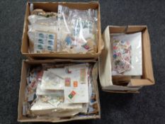 Three boxes containing a large quantity of 20th century loose stamps of the world.