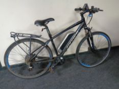 A Carrera Crossfire electric bike with charger (currently not working) and various replacement