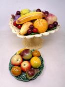 Two ceramic fruit table decorations.