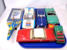 A tray of seven tin plated vehicles, radio patrol police car,