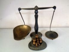 A set of vintage Salter balance scales with weights.