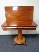 A Victorian mahogany turn over top pedestal tea table.