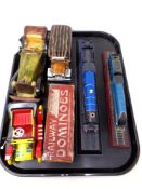 A tray containing two Atlas edition model trains on plinths,