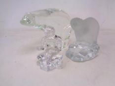 Two glass ornaments, polar bears, together with a further glass ornament, seated figure.