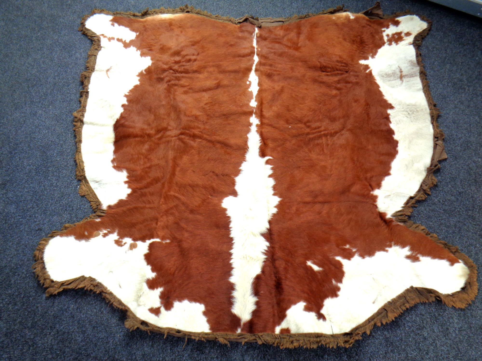 A cowhide rug.