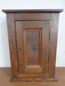 An antique continental oak hanging wall cabinet