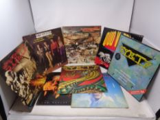 A box of vinyl rock LP's including Saxon, Alice Cooper, Scorpions,