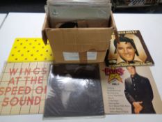 A box containing vinyl LPs and singles including easy listening, Shirley Bassey, Diana Ross,