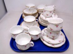 Six Salisbury white and gilt china trios together with six further pink rose patterned bone china