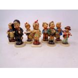 Eight West German Goebel Hummel figures.