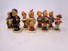 Eight West German Goebel Hummel figures.